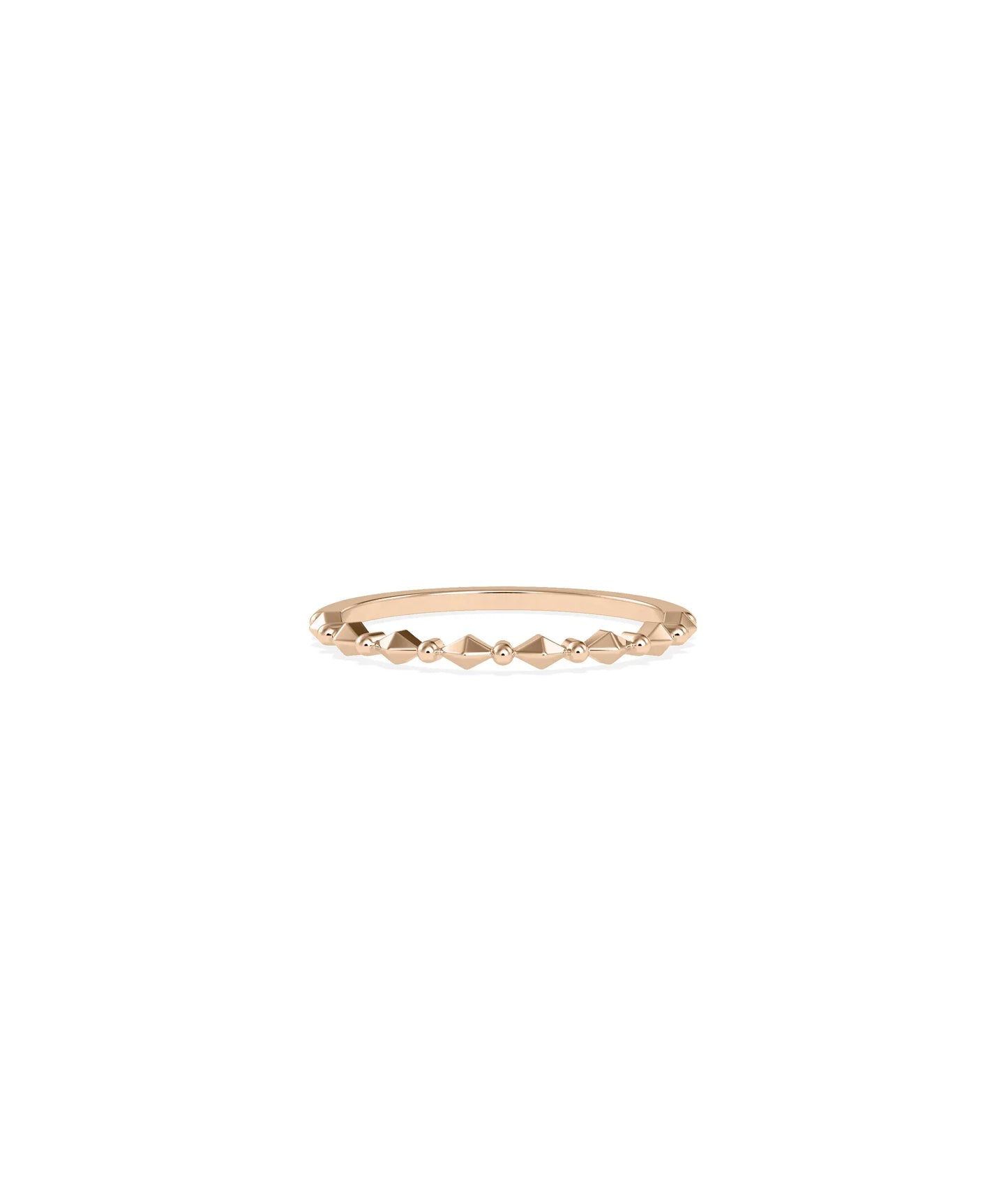 Rose gold faceted ring featuring geometric precision-cut pattern and shimmer