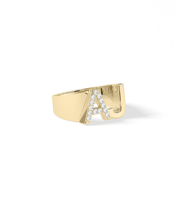 Statement diamond initial ring showing sparkle and oversized letter design