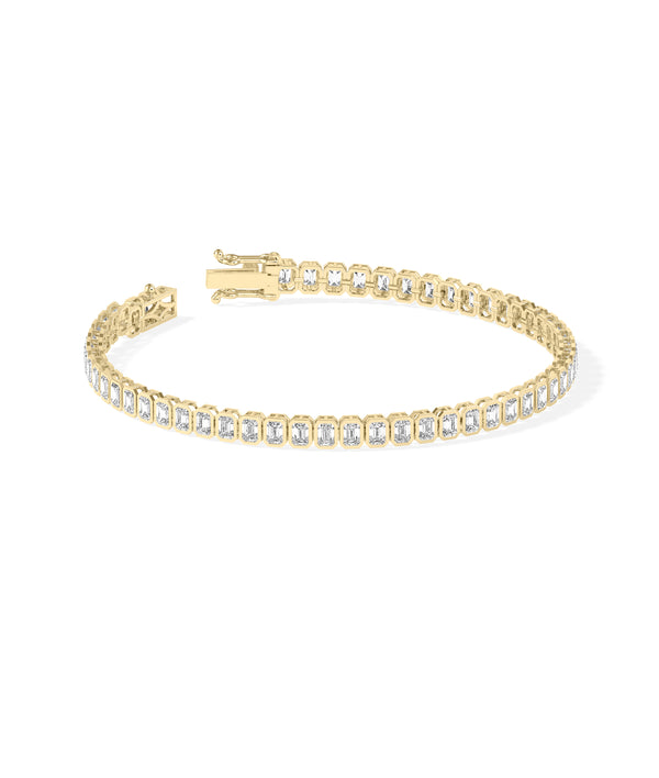 Bezel set emerald cut tennis bracelet in yellow gold side profile view alternate view