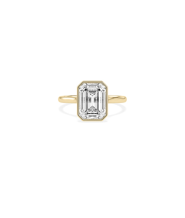Bezel set emerald lab diamond solitaire ring in yellow gold