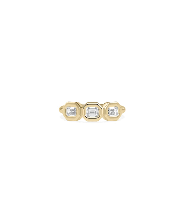 Emerald cut bezel set diamond band ring in yellow gold
