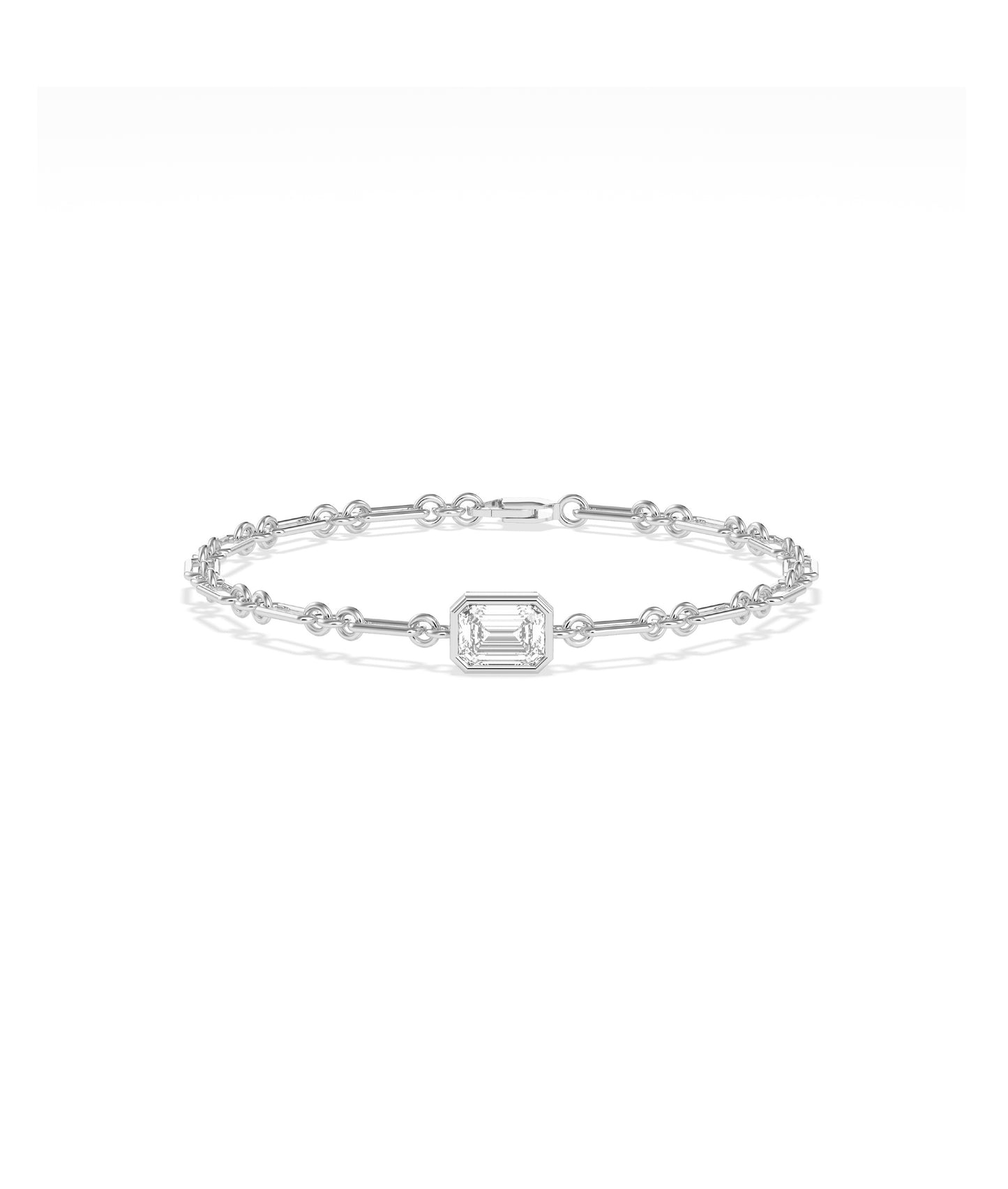 White gold chain bracelet featuring a bezel-set emerald-cut diamond centerpiece with bar and circle links