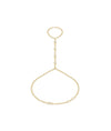 14k yellow gold hand chain with bezel-set diamonds connecting a finger ring to a wrist bracelet