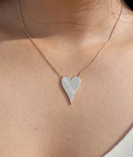 Close-up showing two parallel diamond rows outlining 25mm heart