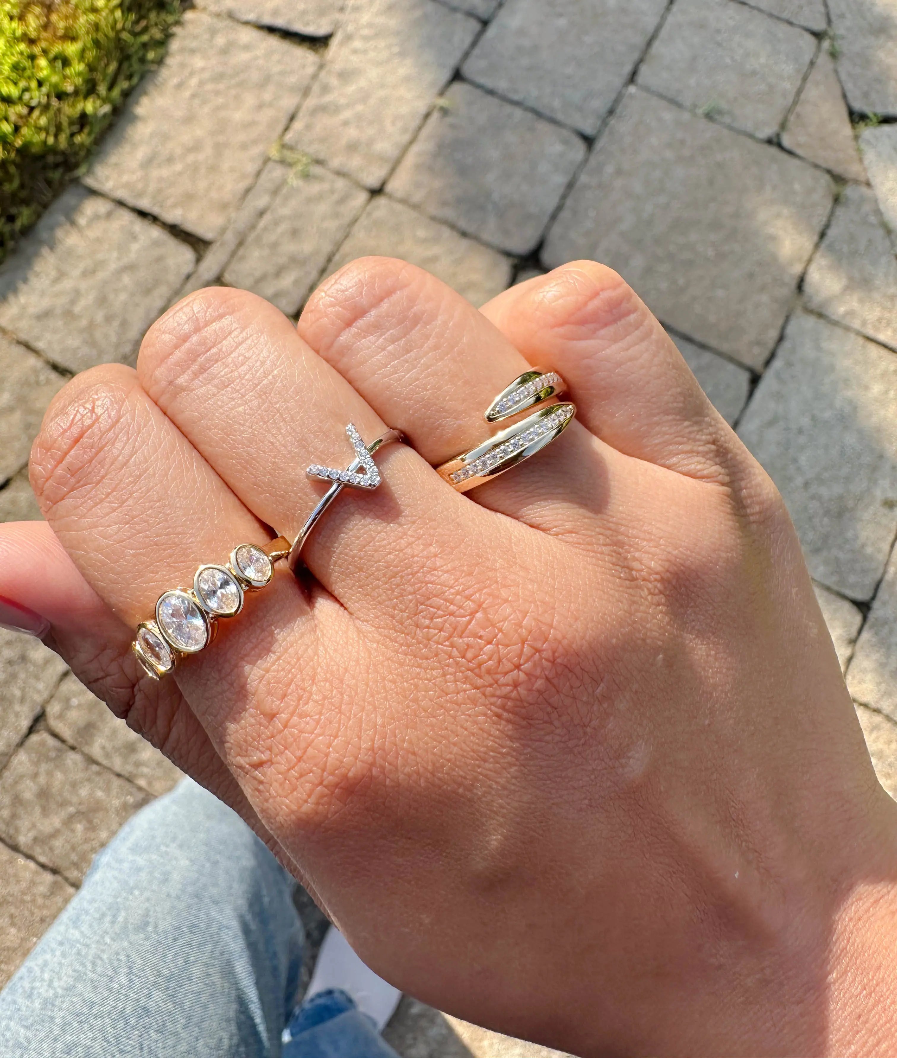 5 Stone Graduating Bezel Set Oval Diamond Band Ring worn displaying dimensional flow