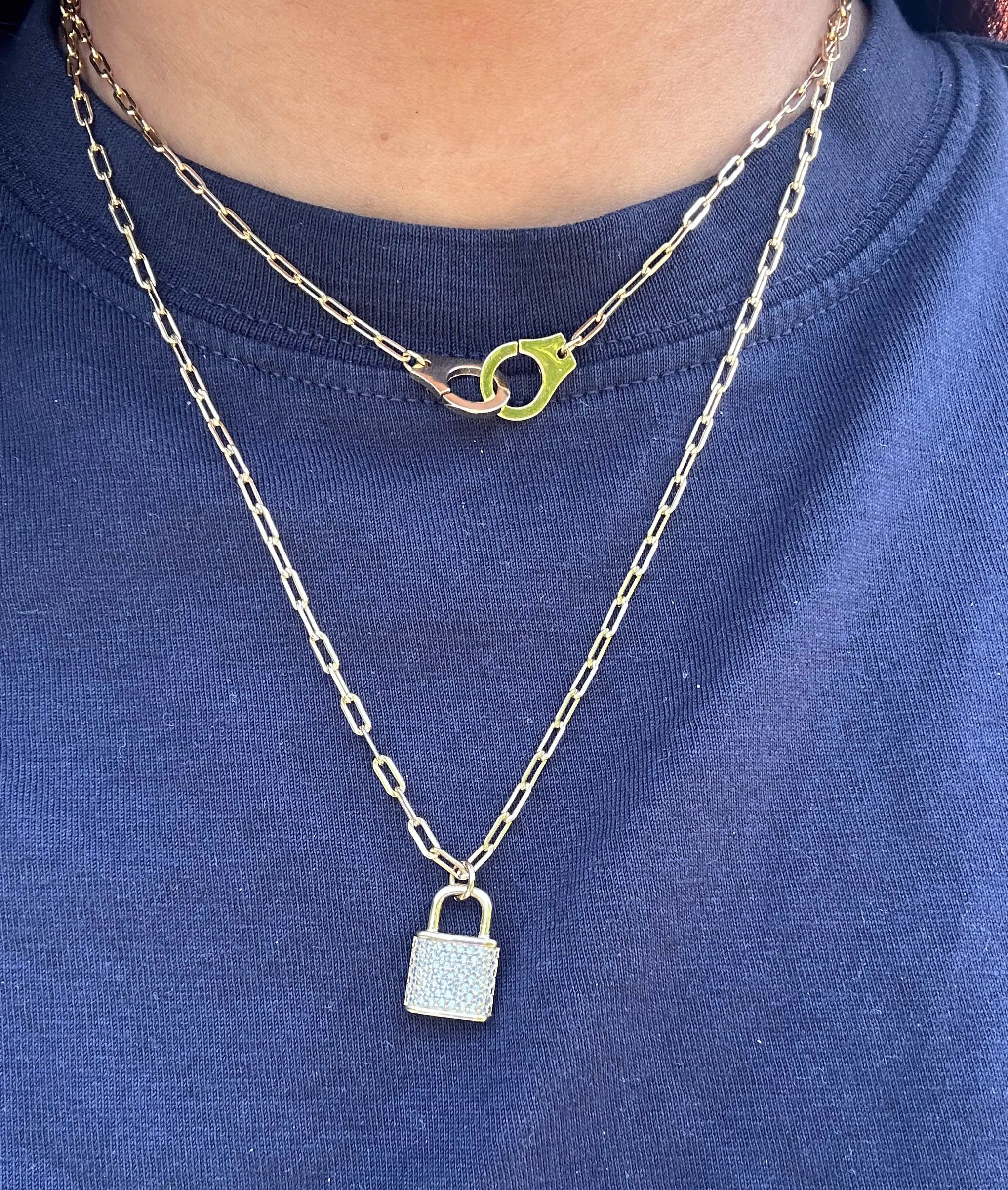 Paper Clip Necklace with Handcuff Charm worn on model displaying confident edge
