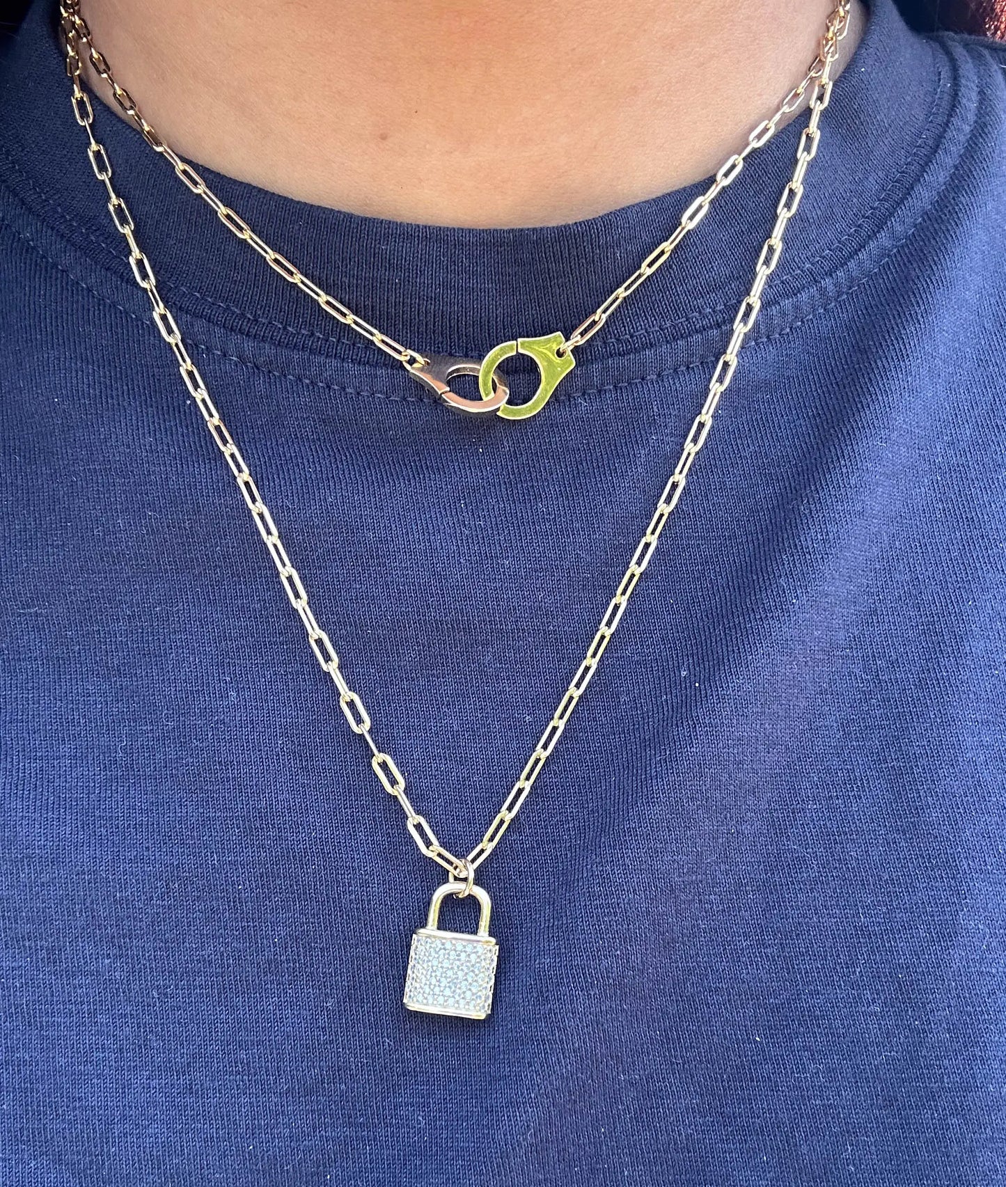 Paper Clip Necklace with Handcuff Charm worn on model displaying confident edge