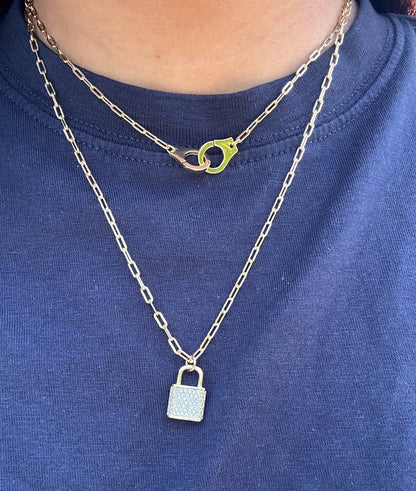 Paper Clip Necklace with Handcuff Charm worn on model displaying confident edge