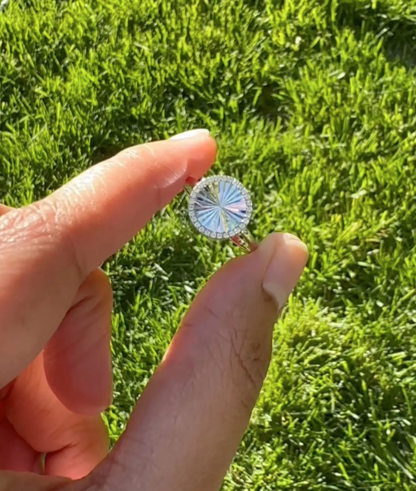 Fluted Circle Ring worn on hand displaying circular diamond detail naturally