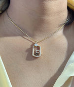 Diamond glass locket charm elegantly displayed on jewelry presentation