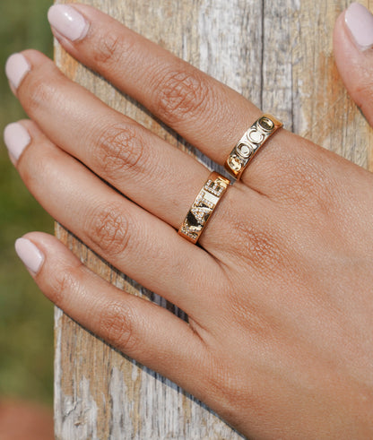 Custom gold name ring showing smooth surface and engraving space detail