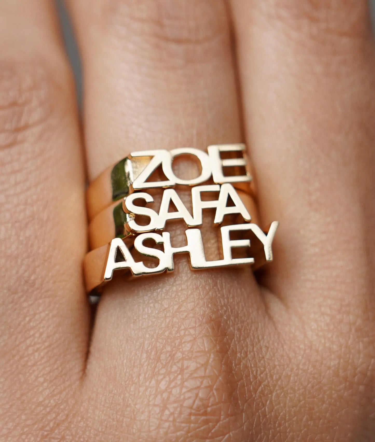 Personalized monogram ring close up of initial detail in solid gold