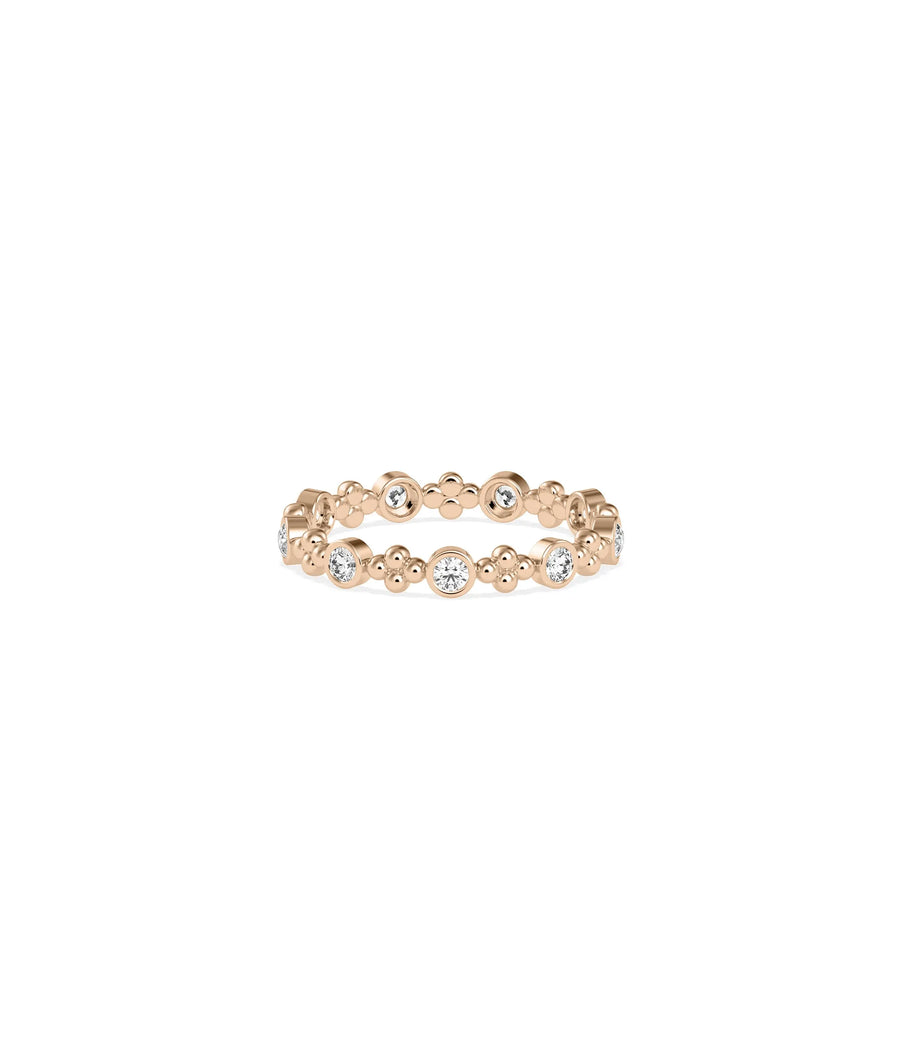 Rose gold eternity ring featuring diamond stations and decorative bead detailing