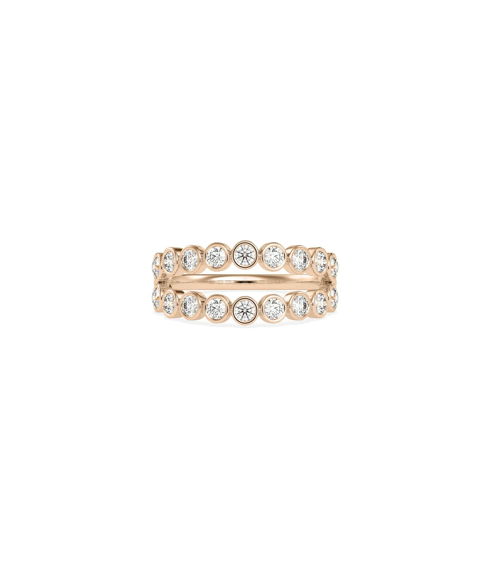 Rose gold double row ring featuring bezel-protected diamonds in elegant alignment