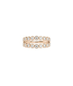 Rose gold double row ring featuring bezel-protected diamonds in elegant alignment