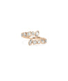 Rose gold bypass ring featuring mixed shapes and sleek modern bezel settings