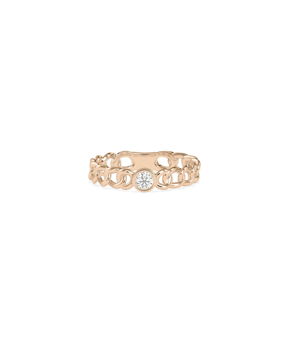 Rose gold solitaire ring featuring curb link chain-style band with diamond