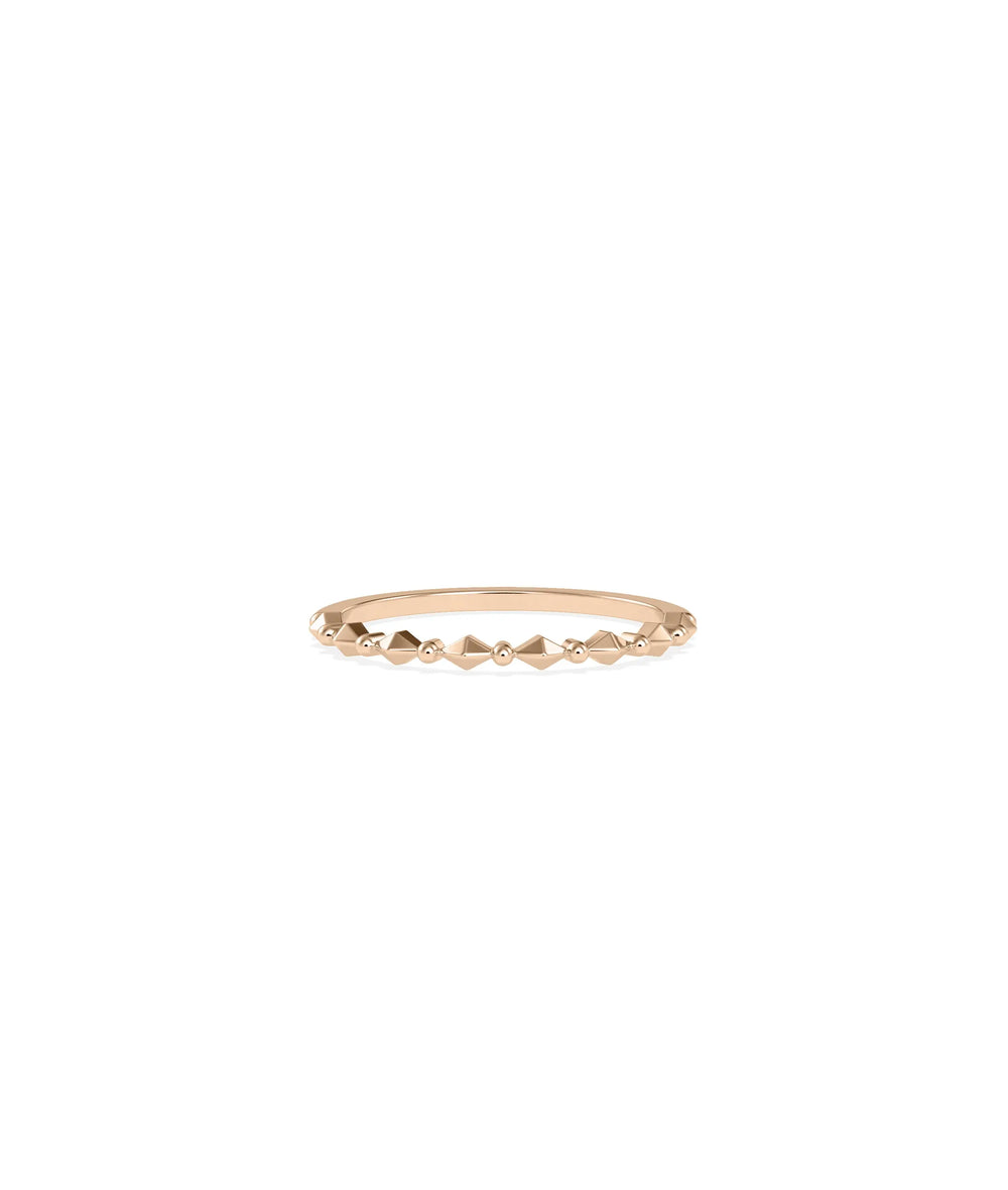 Rose gold faceted ring featuring geometric precision-cut pattern and shimmer