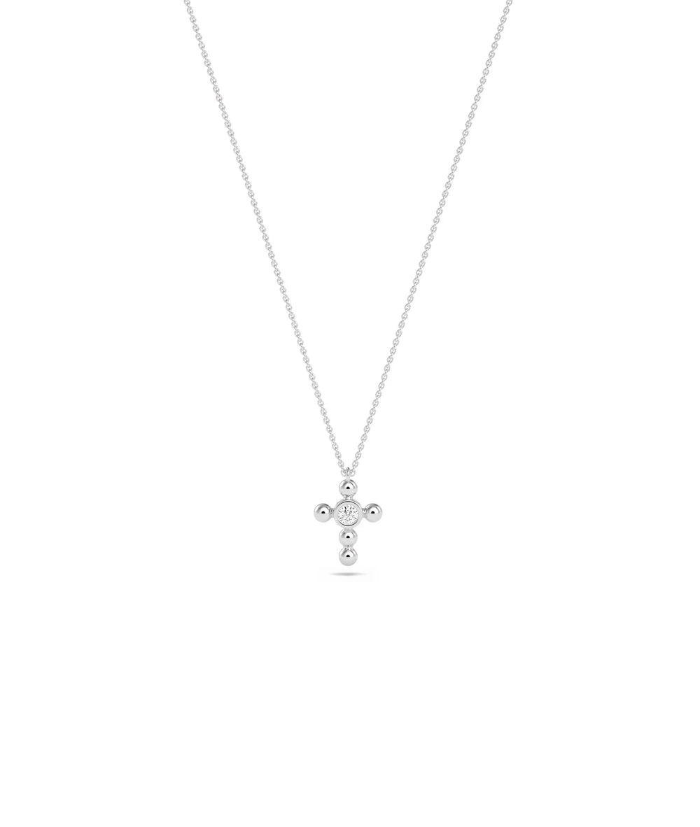 Diamond Solitaire Cross Charm in white gold elegant spiritual