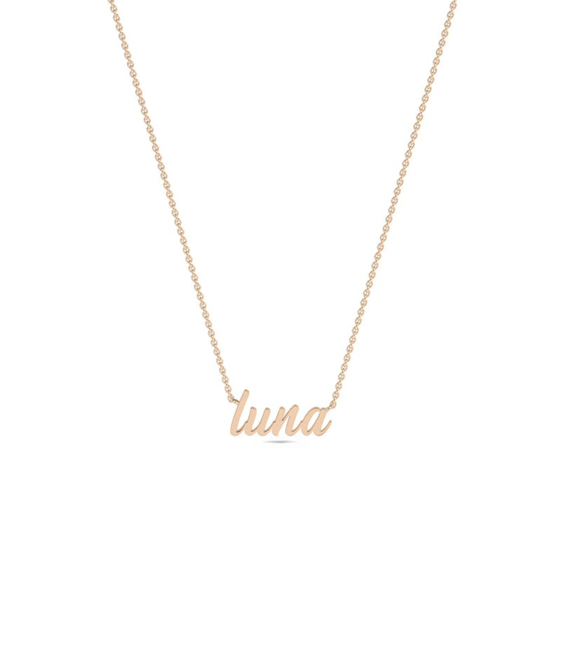 Custom Rose Gold Name Necklace layered with other chains showing versatile styling