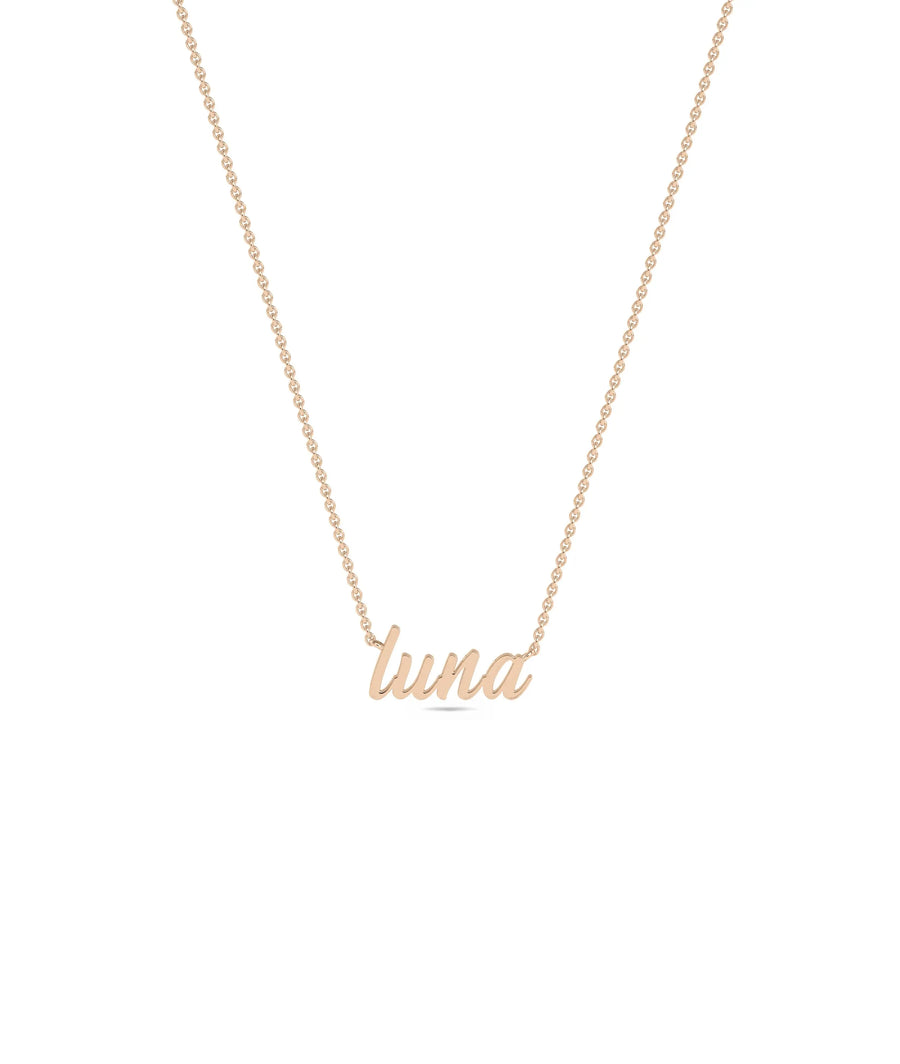 Custom Rose Gold Name Necklace layered with other chains showing versatile styling