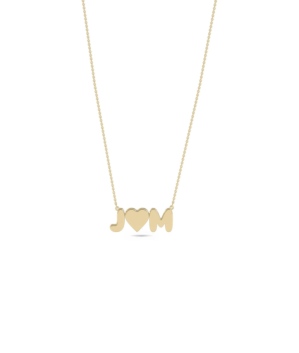Custom Initial and Heart Necklace in yellow gold with personalized letter and heart charms
