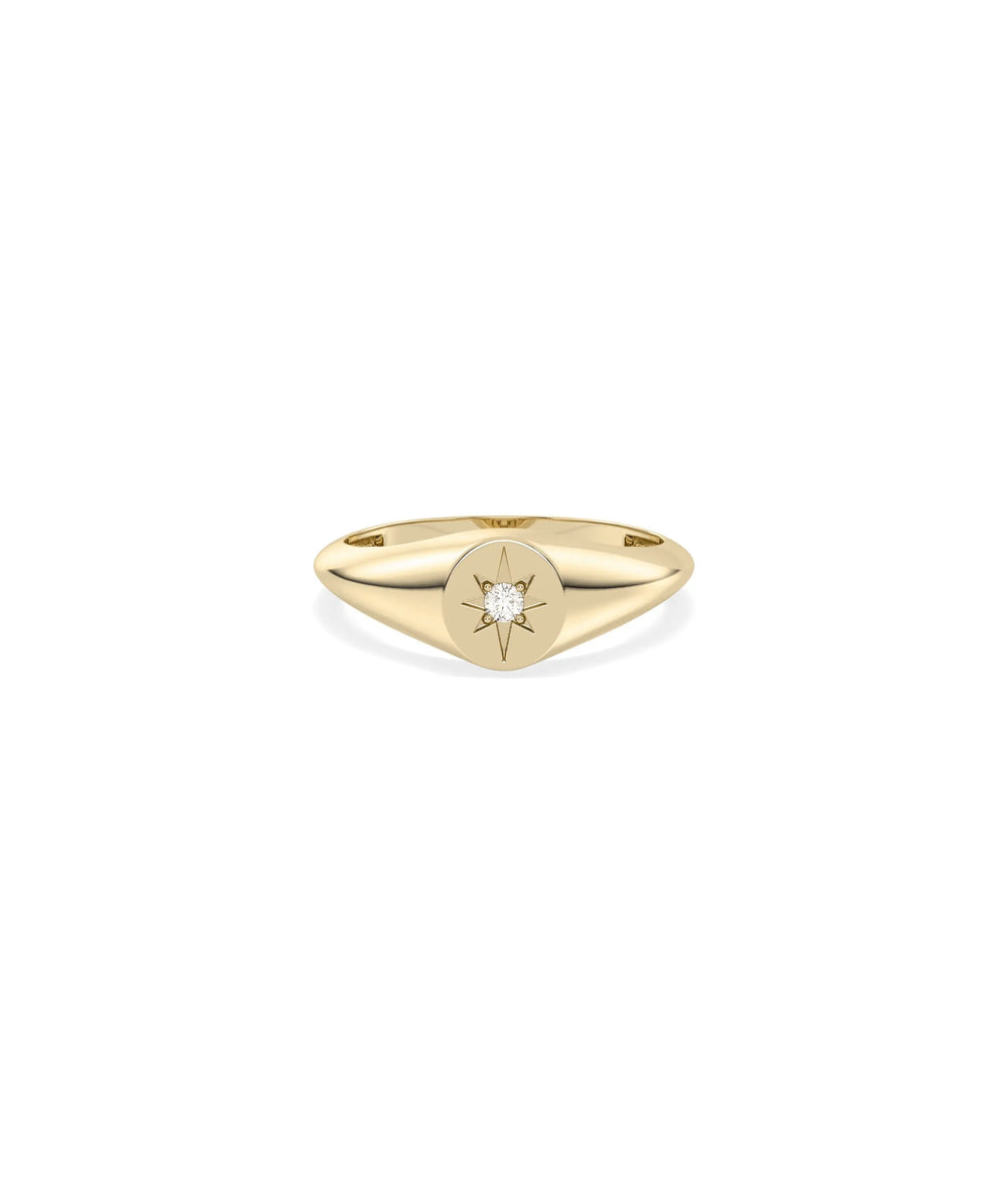 Diamond Star Burst Signet Ring in yellow gold with starburst pattern on circular face