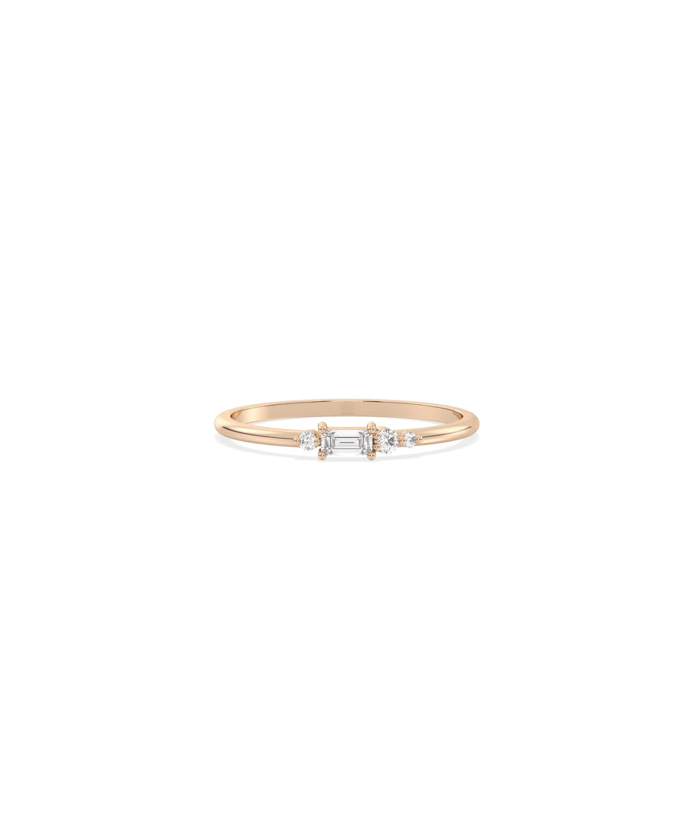 Rose gold cluster band ring featuring baguettes and brilliant diamond groups