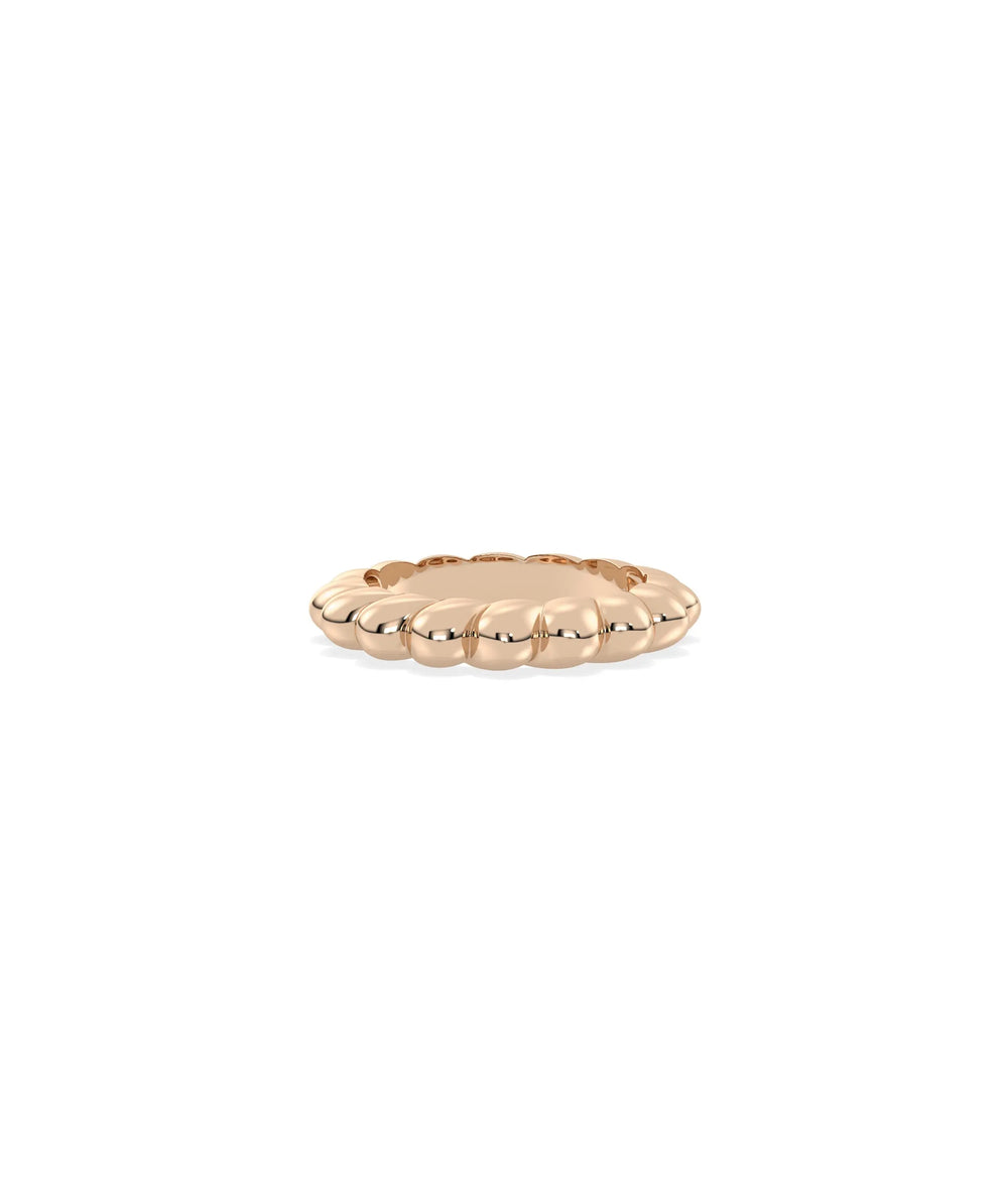 Rose gold twist ring featuring dynamic visual movement and sophisticated curves