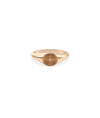 Rose gold signet ring featuring elegant fluted texture and circular detail