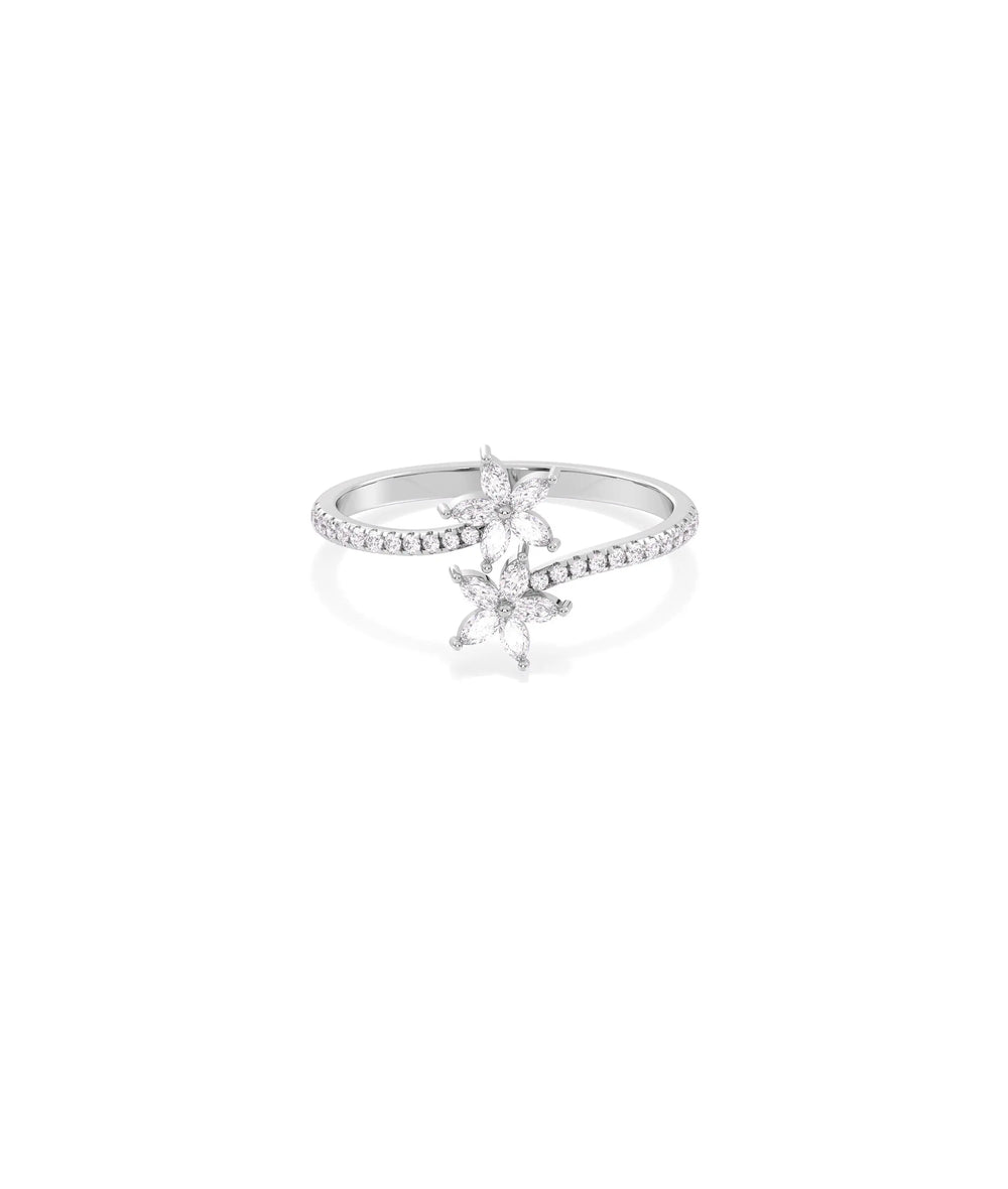 Diamond Flower Bypass Ring in white gold featuring sparkling flower motif on bypass bands