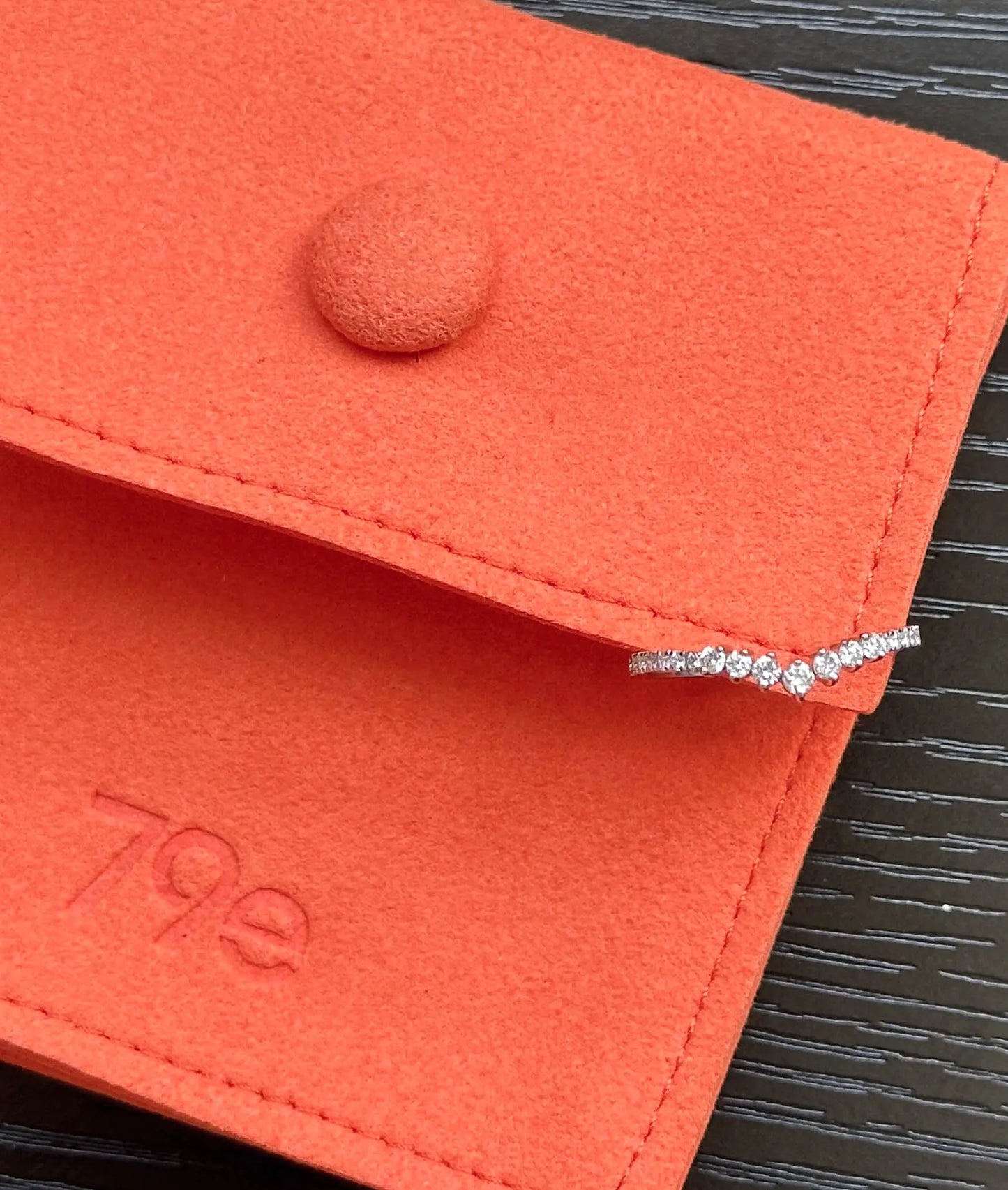 Diamond Chevron Band Ring stacked with other bands showing chevron geometry