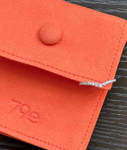 Diamond Chevron Band Ring stacked with other bands showing chevron geometry