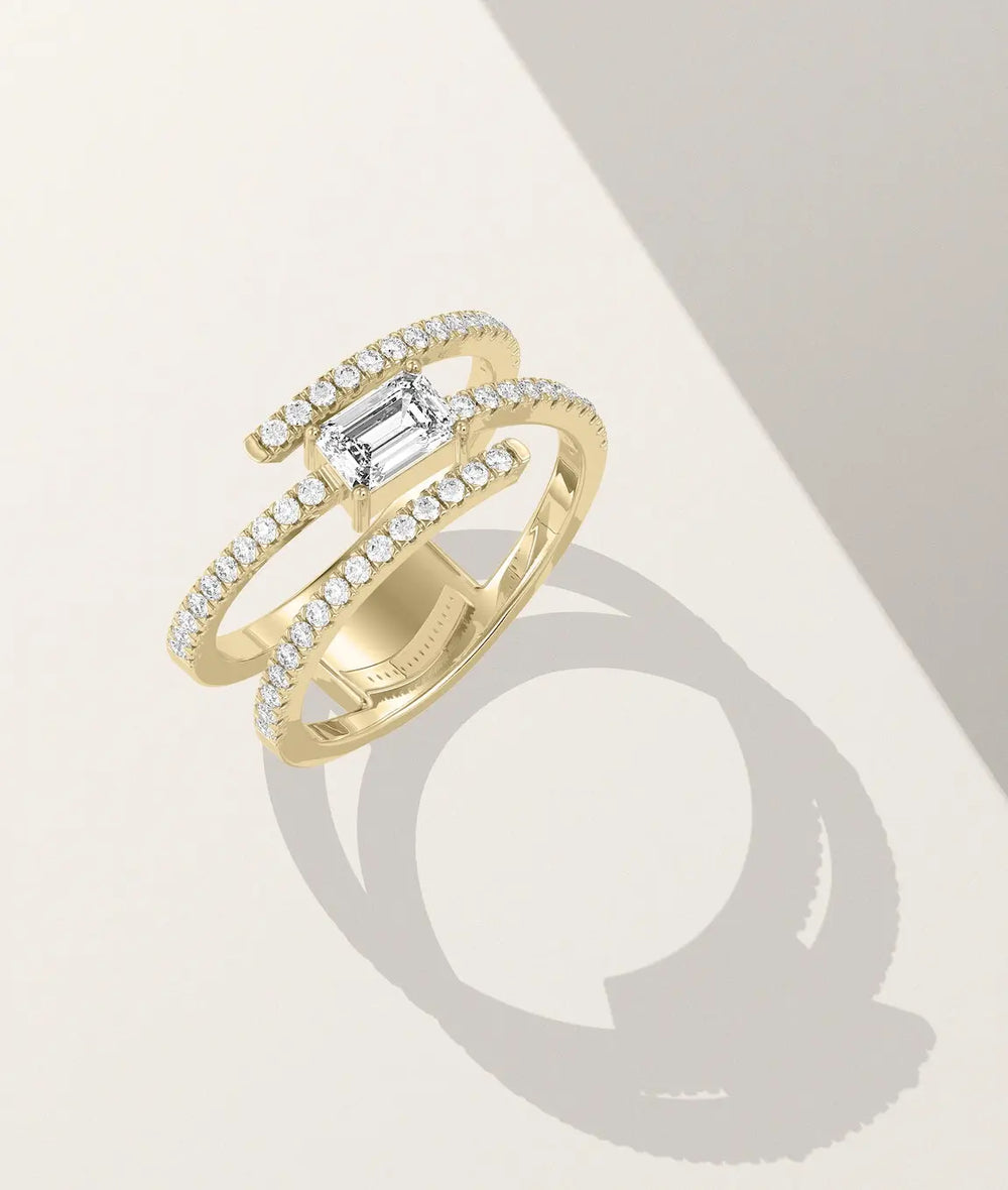 Swirl solitaire ring side profile displaying flowing band design with diamonds