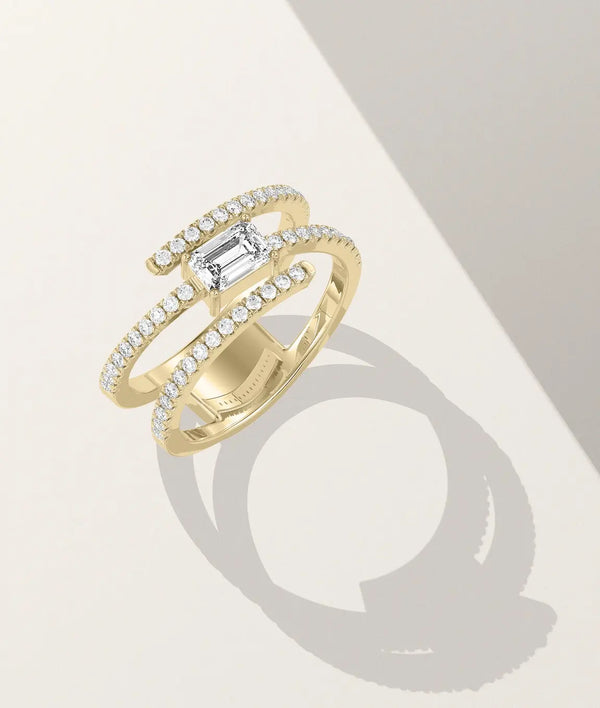 Swirl solitaire ring side profile displaying flowing band design with diamonds alternate view