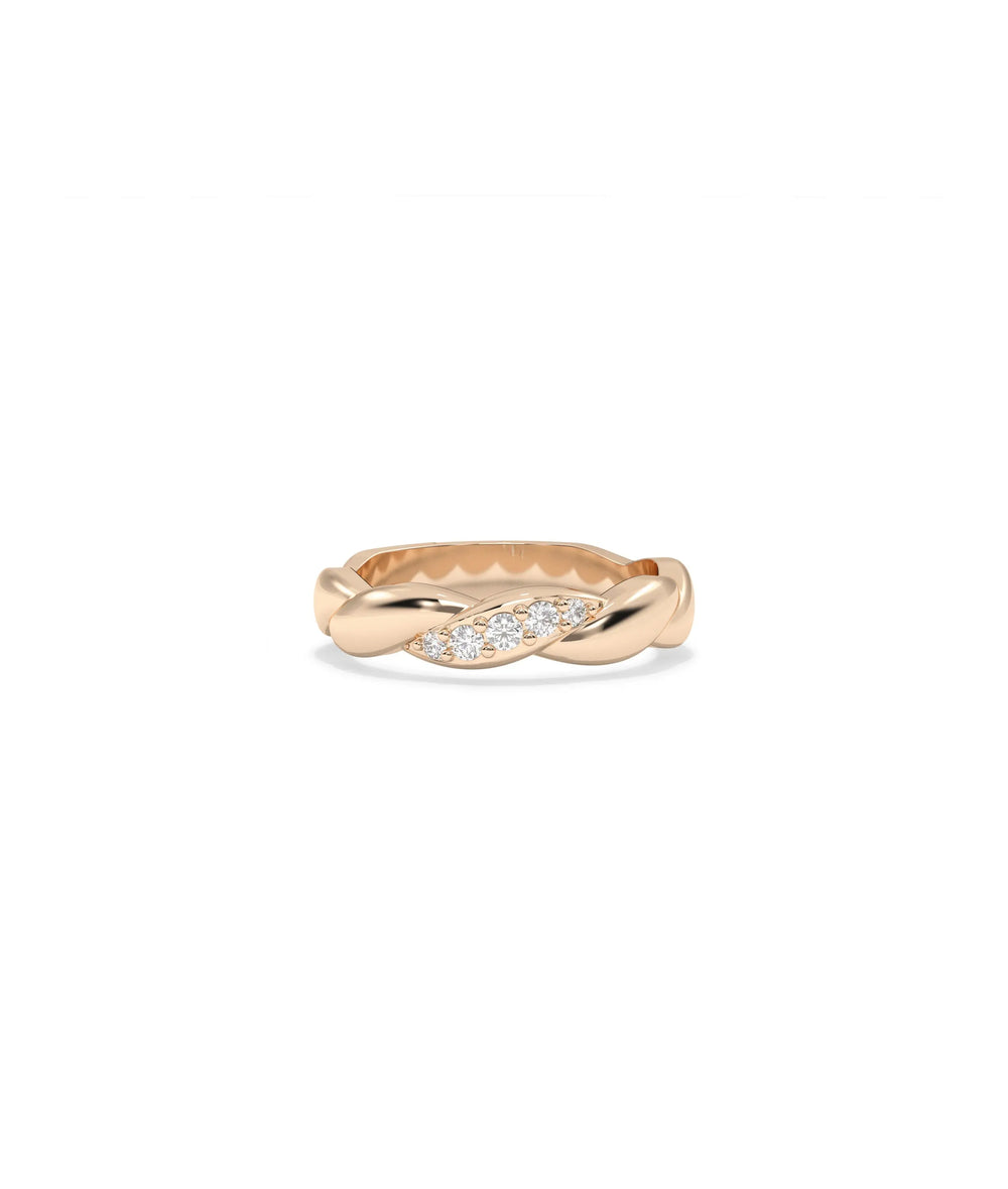 Rose gold twist ring featuring sculptural spiral design with diamond accents