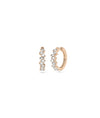 Rose gold baguette hoops featuring linear diamond arrangement and chic elegance