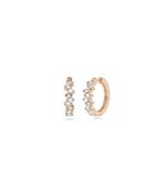 Rose gold baguette hoops featuring linear diamond arrangement and chic elegance