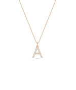 Diamond Pave Initial Charm in rose gold highlighting personalized warm tones