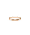 Rose gold bone ring featuring continuous eternity pattern and unique character