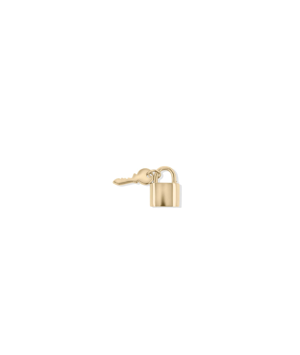 Lock and Key Gold Charm in rose gold highlighting romantic warm tones