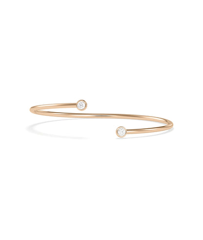 Gold flex bangle two bezel diamonds profile angle showing adjustable construction design