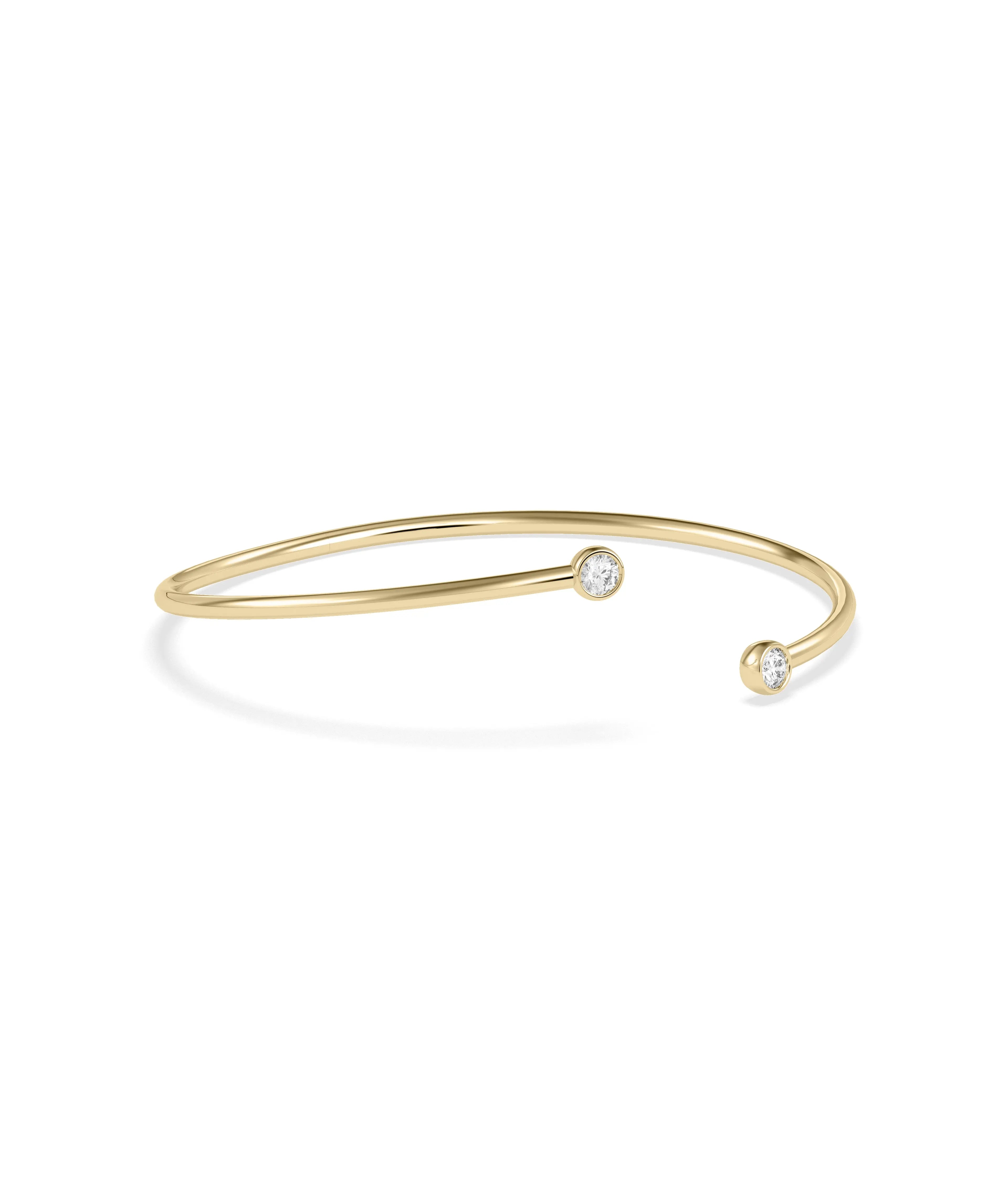 Two stone diamond bangle bezel set solid gold flex construction closeup detail view