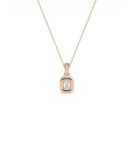 Bubble Solitaire Charm flat lay showing diamond bail and bubble bezel center stone