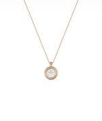Gold double bezel diamond charm side view highlighting two layer construction and depth