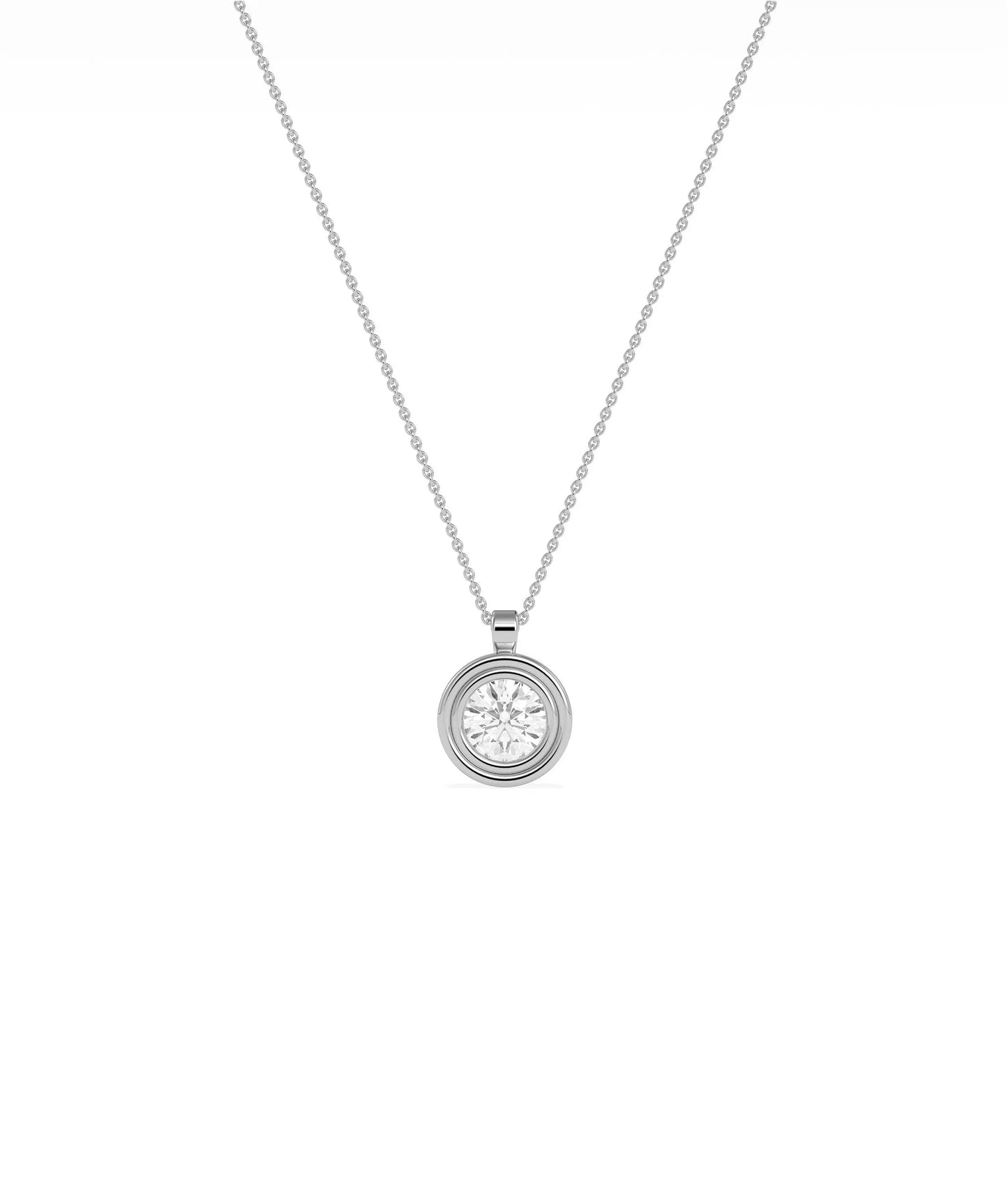 Gold double bezel diamond charm flat lay showing attachment loop and craftsmanship detail