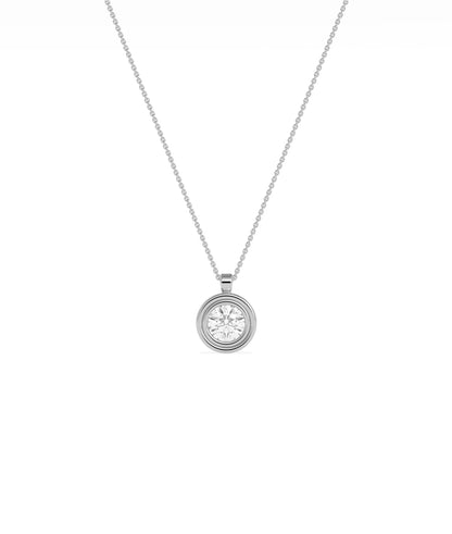 Gold double bezel diamond charm flat lay showing attachment loop and craftsmanship detail