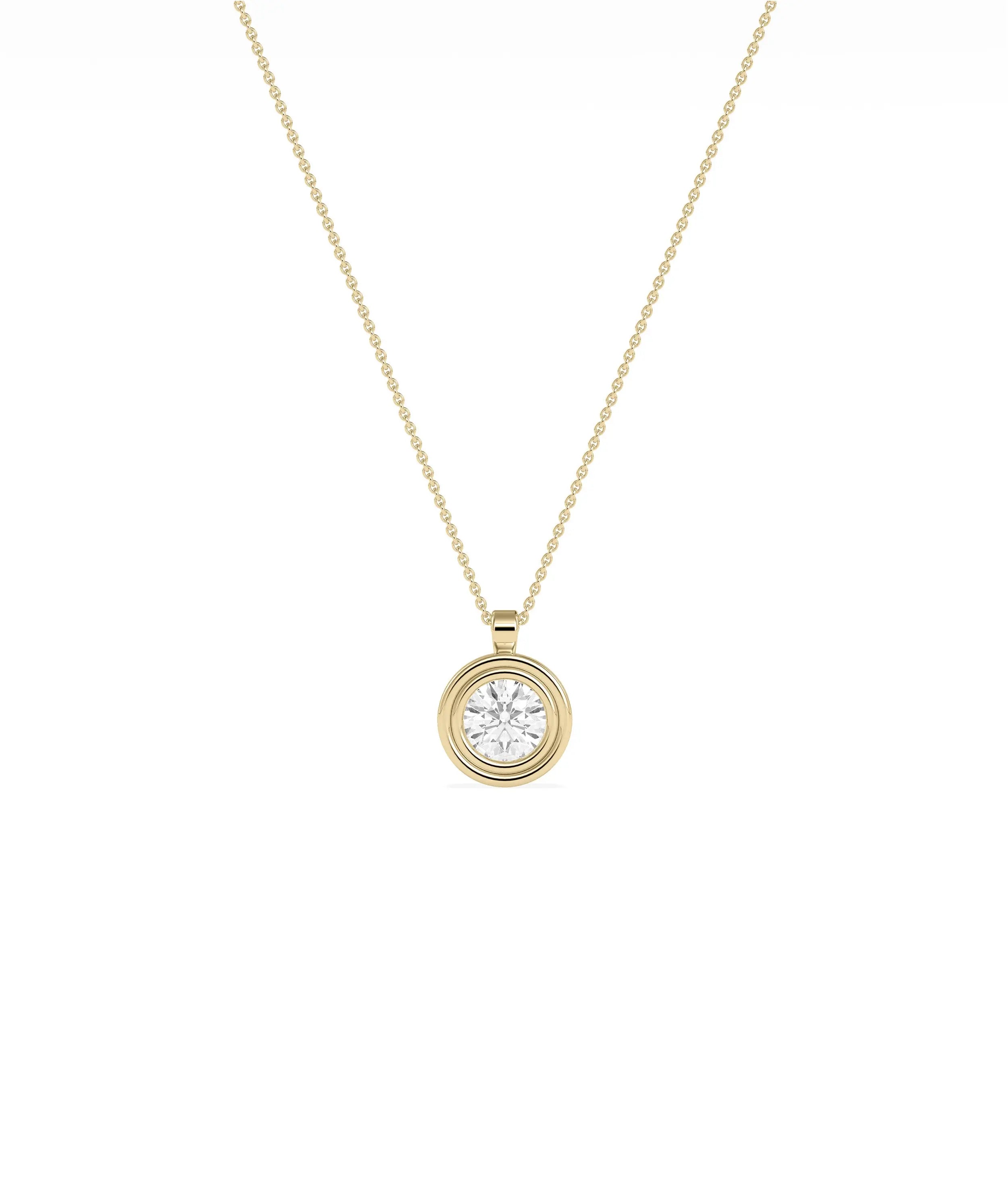 Layered bezel diamond charm solid gold concentric design closeup showing dimensional depth