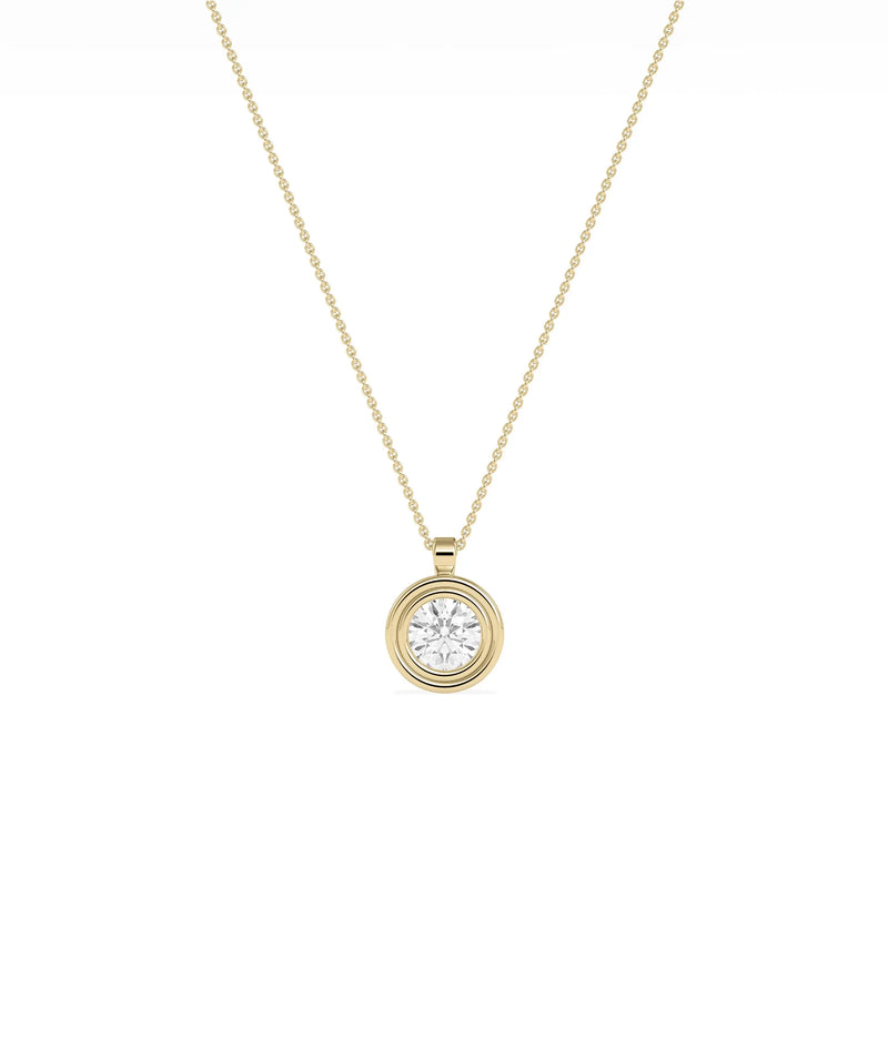 Layered bezel diamond charm solid gold concentric design closeup showing dimensional depth