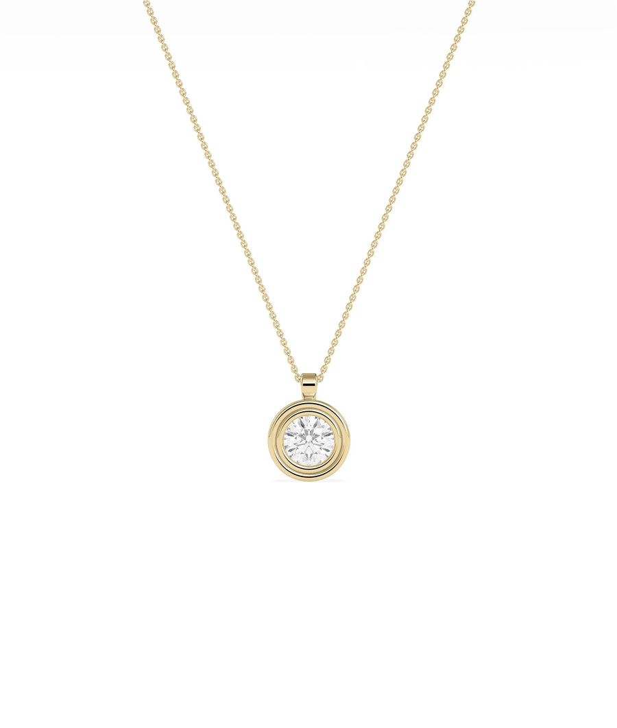 Layered bezel diamond charm solid gold concentric design closeup showing dimensional depth